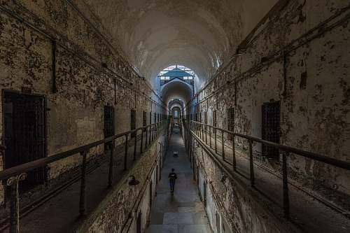eastern state penitentiary man walking near cubicles inside building philadelphia